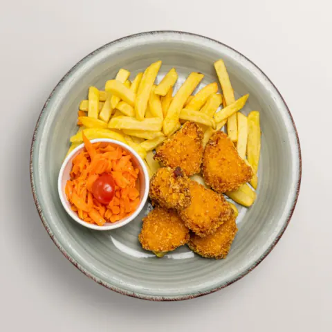 Chicken nuggets with French fries and carrot salad