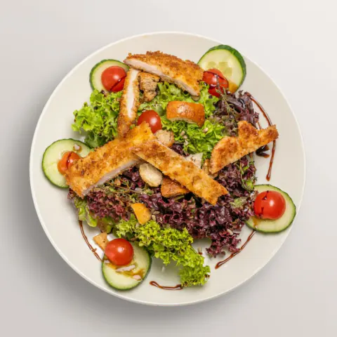 Fresh salad with crisp strips of schnitzel