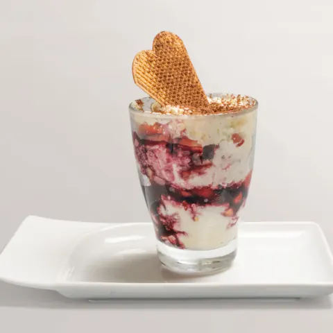 Strawberry tiramisu dusted with cocoa