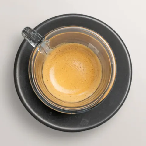 Freshly brewed espresso in a glass cup